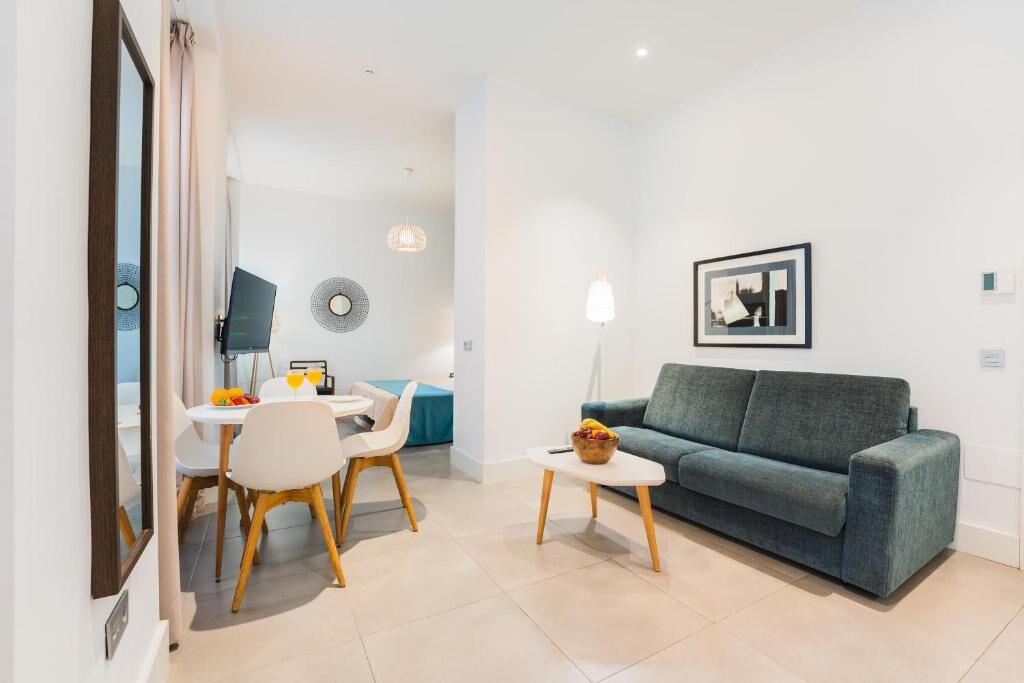Living and dining area of an apartment at Debambú Larios