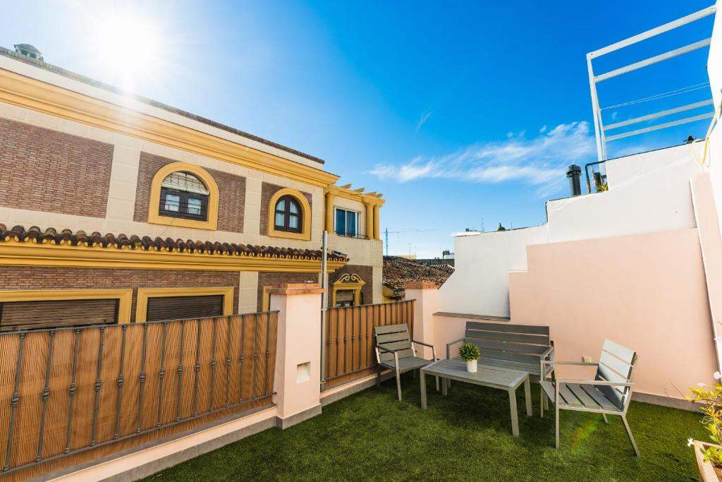 Rooftop sun terrace above the rooftops of Málaga